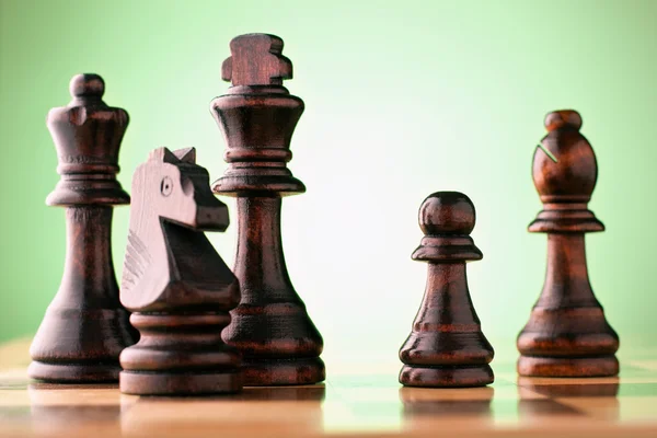 Wooden chess pieces on a chessboard — Stock Photo, Image