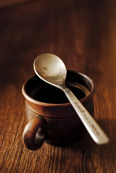 Cup of hot espresso coffee with a spoon — Stock Photo, Image