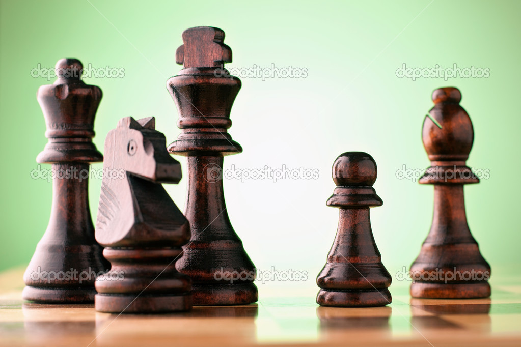 Wooden chess pieces on a chessboard