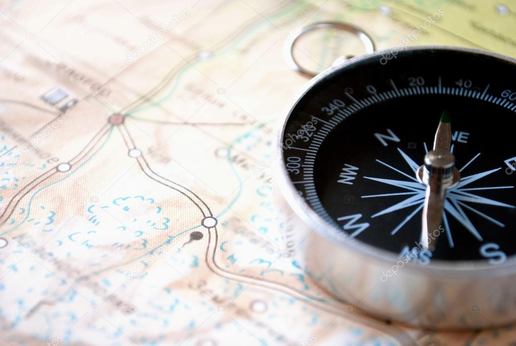 Handheld compass on a map