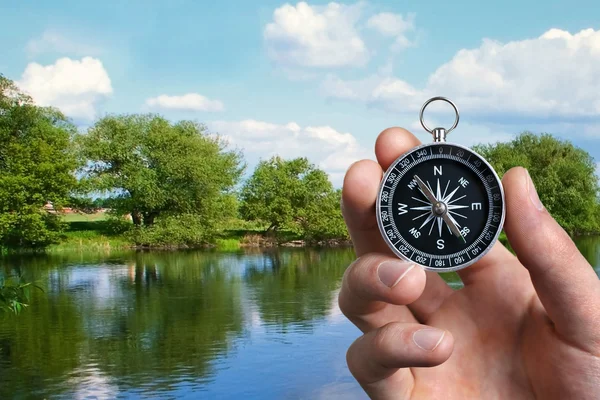 Man navigating the countryside with a compass — Stock Photo, Image