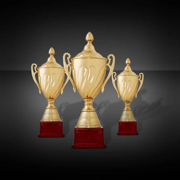 Three gold cups or championship trophies — Stock Photo, Image