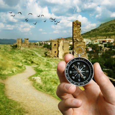 Man using a compass while sightseeing abroad clipart