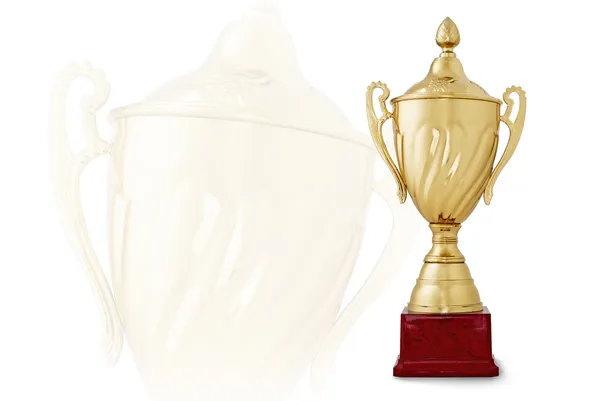 Golden trophy cup on red base on white background — Stock Photo, Image