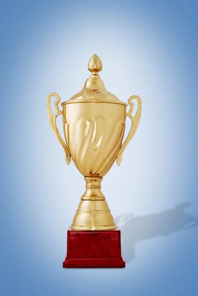 Gold trophy on a blue background — Stock Photo, Image