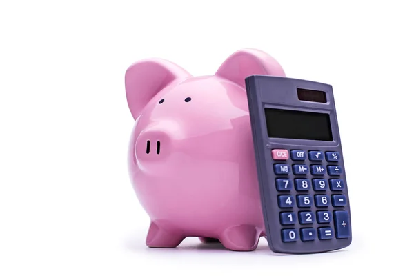 Hucha rosa con una calculadora —  Fotos de Stock