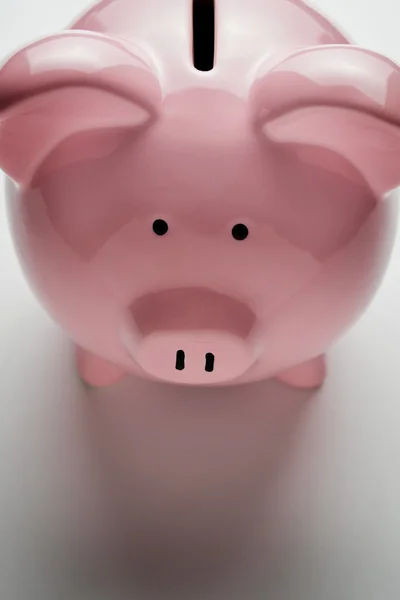 Pink piggy bank showing the coin slot — Stock Photo, Image