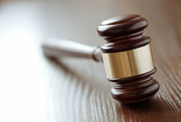 Wooden gavel with a brass band — Stock Photo, Image