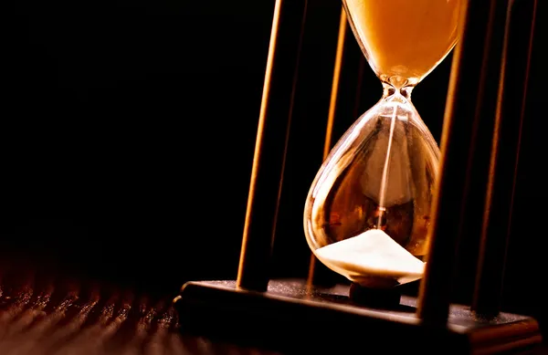 Newly turned hourglass with running sand — Stock Photo, Image