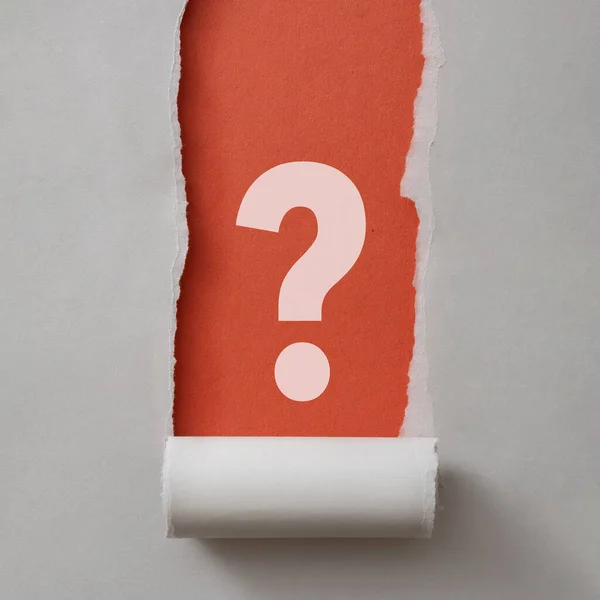 Bold white question mark framed by ripped grey paper neatly rolled to the bottom revealing a red background in square format