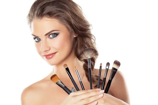 Woman with make-up brushes — Stock Photo, Image