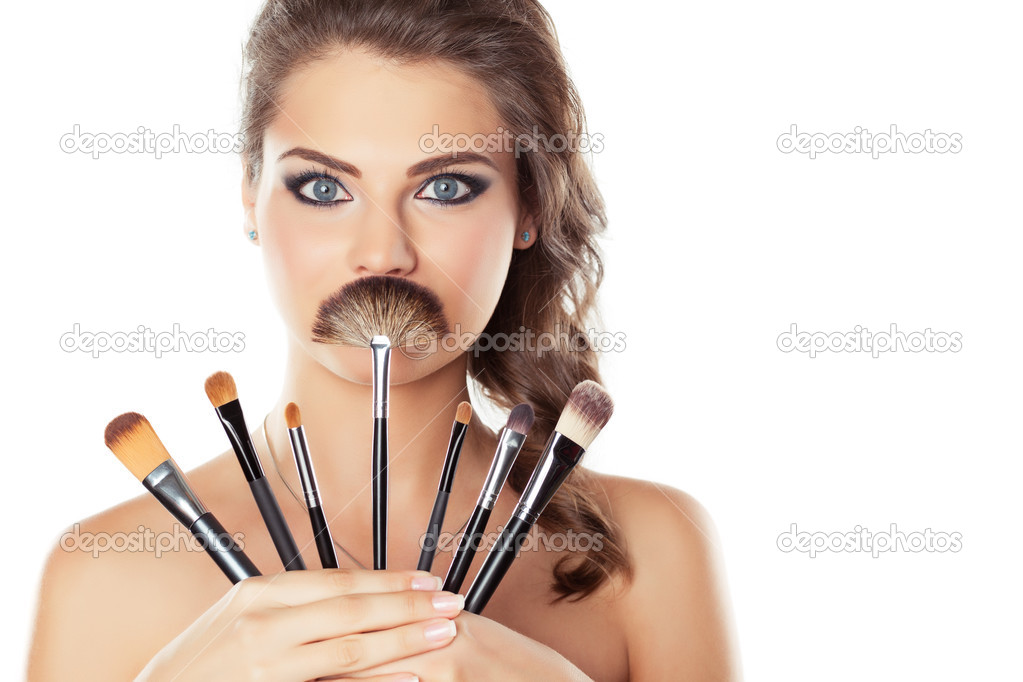 Woman with make-up brushes