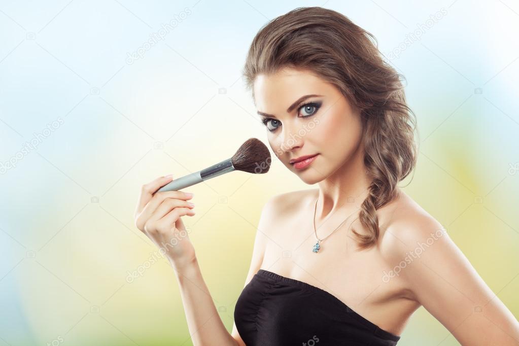 Woman with a make-up brush