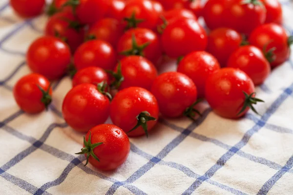 Tomatoes on towel — Stock Photo, Image