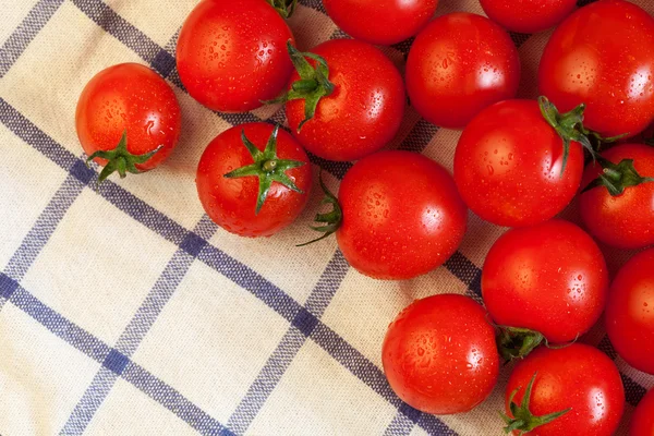 Tomatoes on towel — Stock Photo, Image