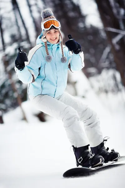 Female snowboarder showing thumbs up — Stock Photo, Image