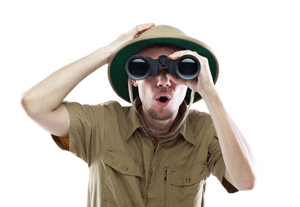 Amazed explorer looking through binoculars — Stock Photo, Image