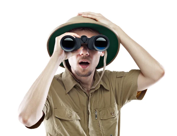 Amazed explorer looking through binoculars — Stock Photo, Image