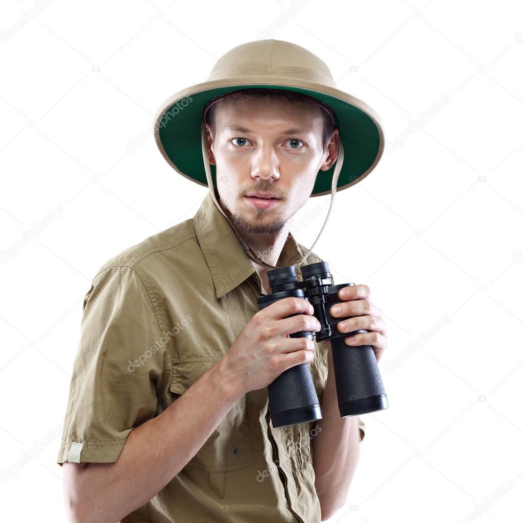Explorer holding binoculars