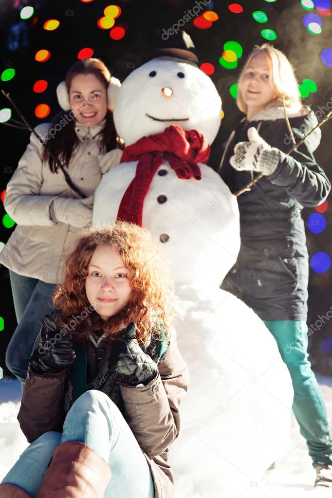 Girls and snowman