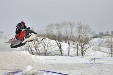 Flight on a snowmobile racer clipart