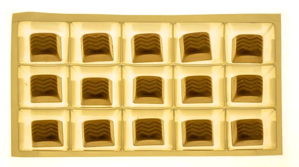 Permen Coklat Dalam Kotak Disinari Dari Bawah Pemandangan Atas — Stok Foto