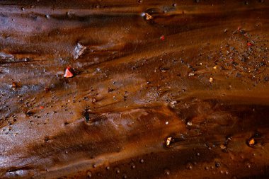 colored mud river, close view