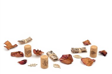 petals of rose flowers, cork plugs, laser carved wood and tree bark on a white background