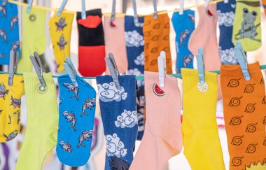 Different Multicolored Socks hanging on the rope