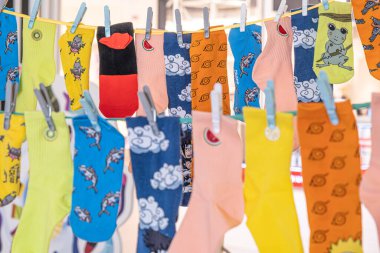 Different Multicolored Socks hanging on the rope