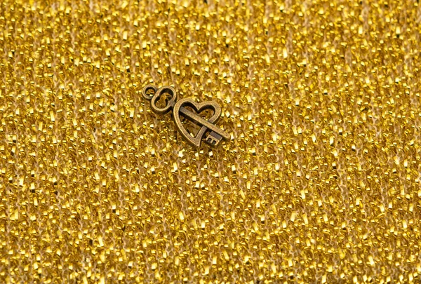 Bronze Ornamental Key Unique Shapes Design Golden Metal Shavings Background — Stock Photo, Image