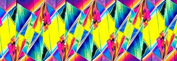 Glass pyramid prism with colorful light reflection on background with copy space