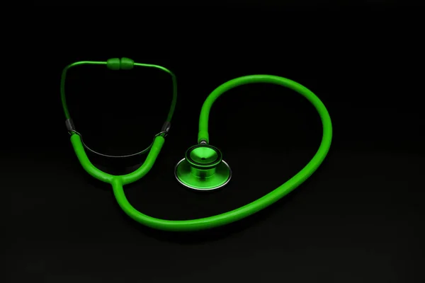 Green Stethoscope Dark Background — Stock Photo, Image