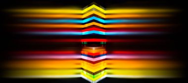 light through Stack of different colours Cast Acrylic Sheet with motion blur effect on black background clipart