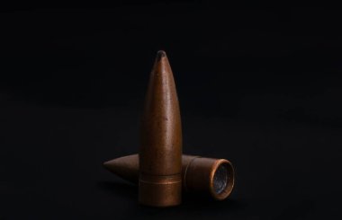 macro shoot of 7.62 caliber bullet on a black isolated background