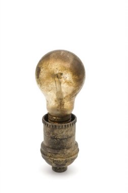 Old Dusty ceiling light bulb in Rural socket