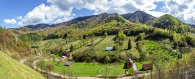 panoramic view of spring hills with Romanian country homes