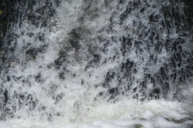 Wild swirling water caught on high speed shutter
