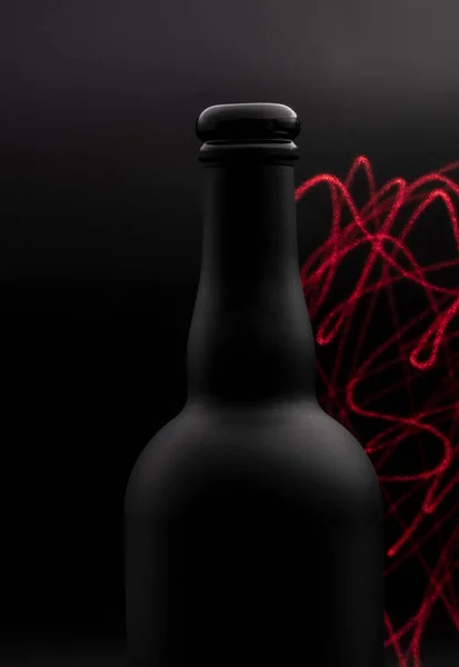 Matte Black Wine Bottle Red Laser Lines Painting Dark Background — Stock Fotó