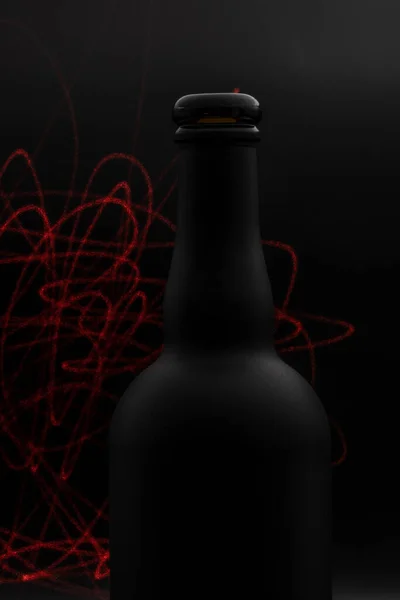 Matte Black Wine Bottle Red Laser Lines Painting Dark Background — Zdjęcie stockowe