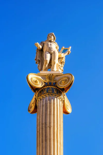 Athens, Greece - February 18, 2020. Statue of Apollo, ancient god of music and poetry. Iconic neoclassic Academy of Athens. historic center in Attica, Greece