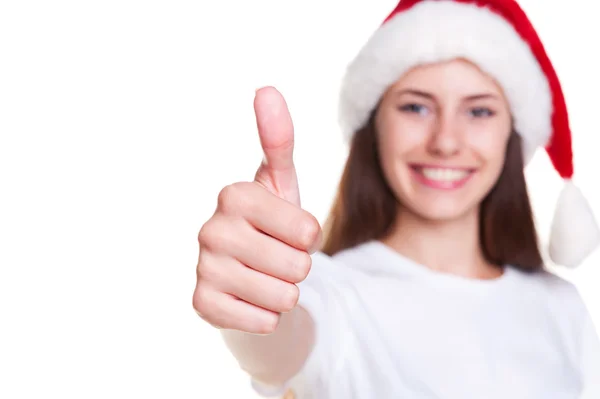 Chica en Santa sombrero mostrando pulgares hacia arriba —  Fotos de Stock