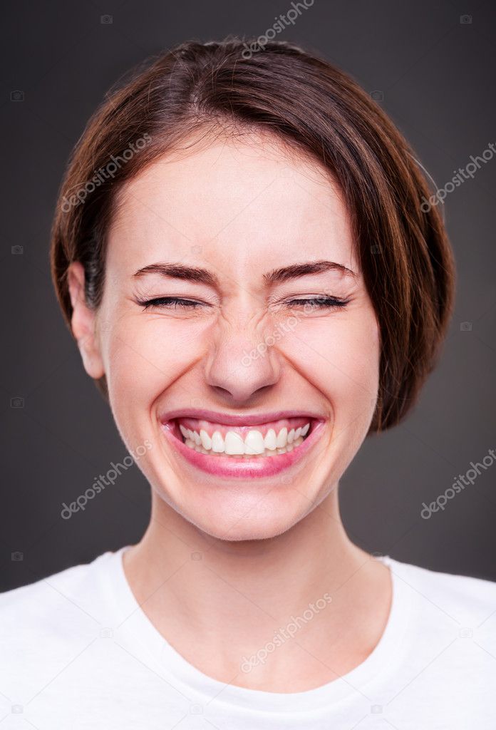 young woman is laughing loudly