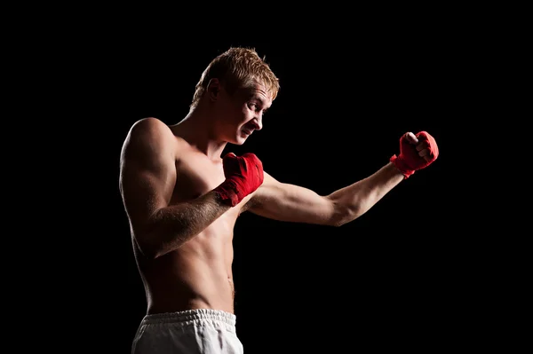 Fighter boxing in the dark room — Stock Photo, Image