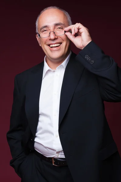 Studio shot of laughing businessman — Stock Photo, Image