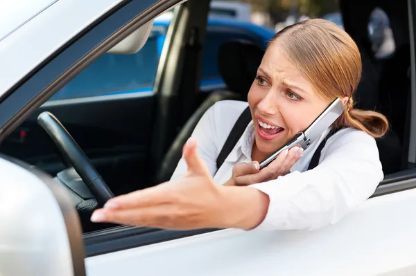 Angry woman in traffic jam — Stock Photo, Image