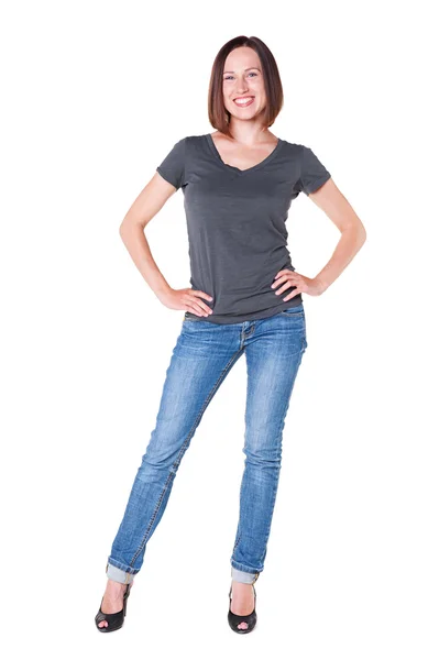 Smiley girl in grey t-shirt and blue jeans — Stockfoto