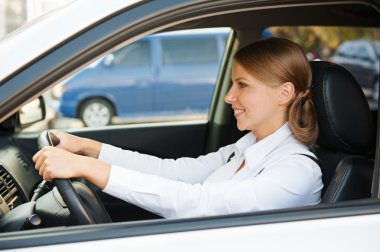 prosperous businesswoman driving the car