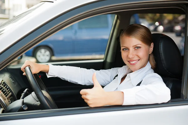 Woman sitting in the new car — Stock Photo, Image