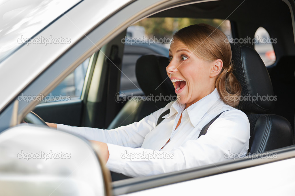 woman in panic is driving the car